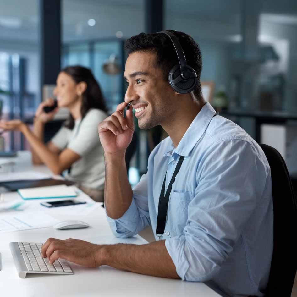 man and woman helping customers at desk